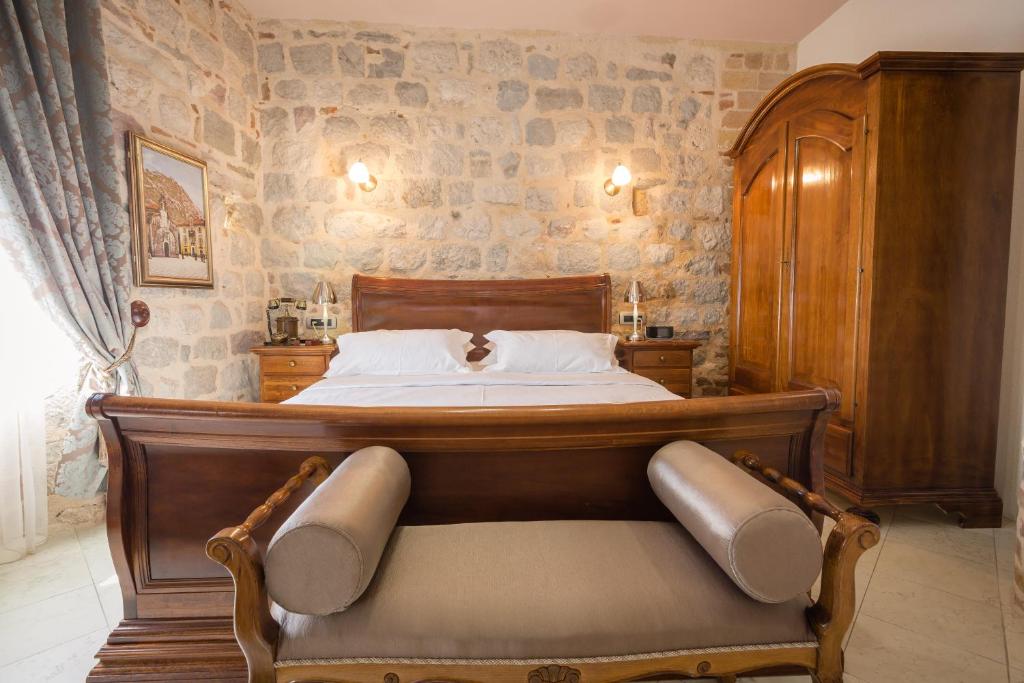 Postel nebo postele na pokoji v ubytování Hotel Villa Duomo