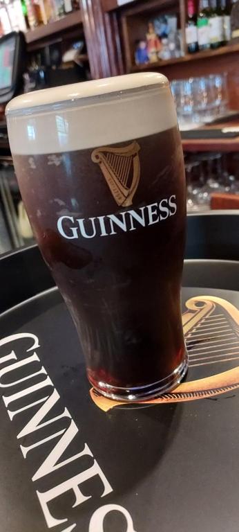 a cup of coffee sitting on top of a counter at Fennessy's Hotel in Clonmel