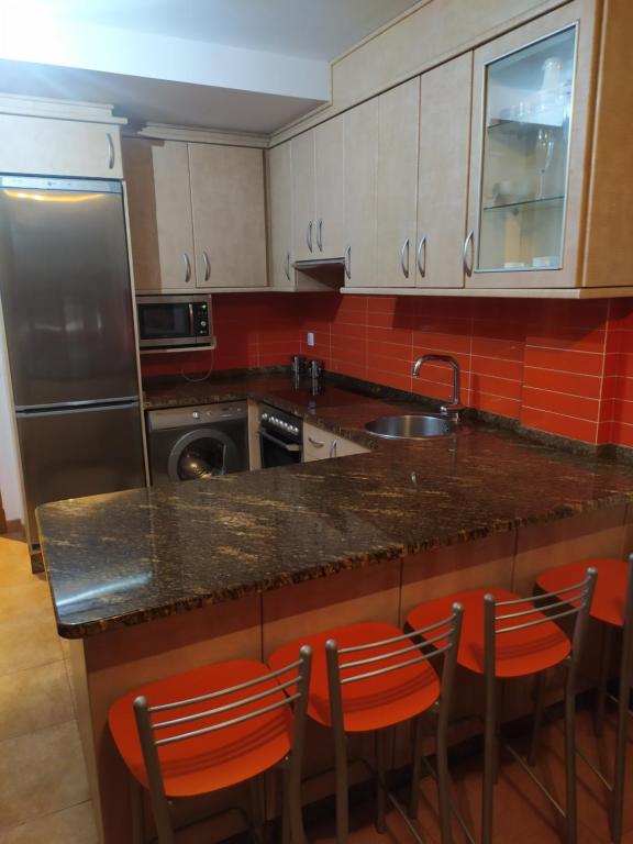 Kuchyňa alebo kuchynka v ubytovaní Apartamento As Laxes de Illa de Arousa