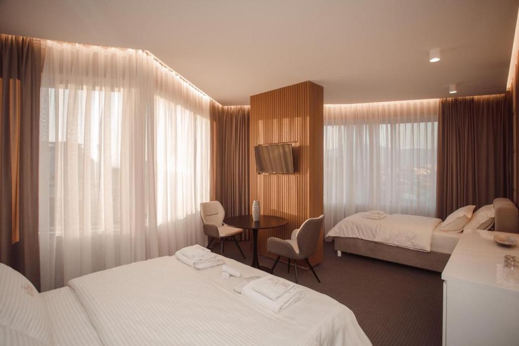 Postel nebo postele na pokoji v ubytování Hotel Chicago