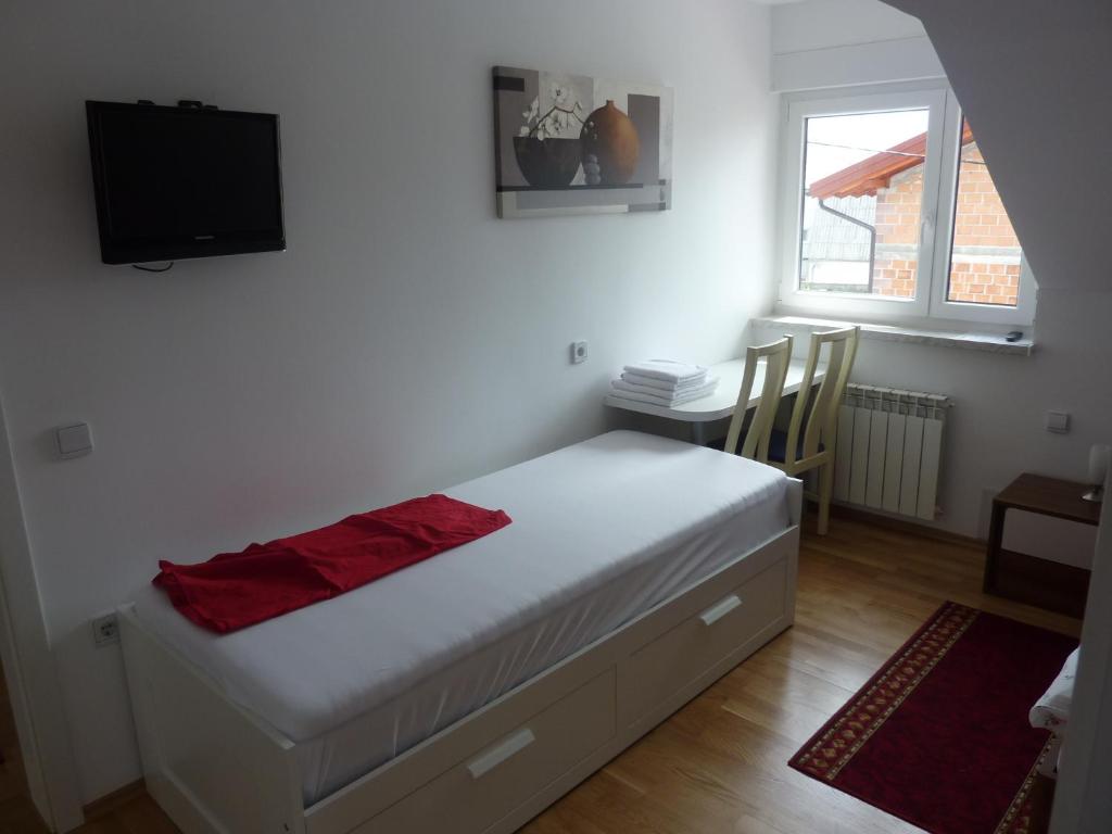 Postel nebo postele na pokoji v ubytování Rooms & Apartment Mira G.