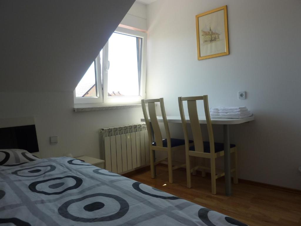 Postel nebo postele na pokoji v ubytování Rooms & Apartment Mira G.