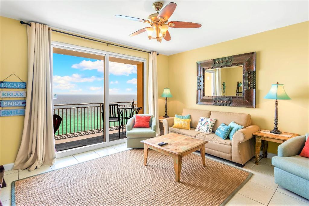 a living room with a view of the ocean at Splash Condo, Aqua Park, Lazy River in Panama City Beach