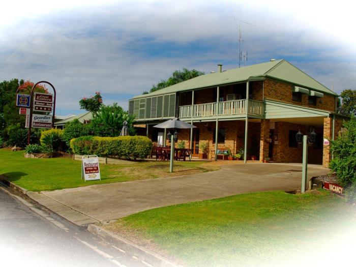a large building with a sign on the side of it at Great Eastern Motor Inn Gympie in Gympie