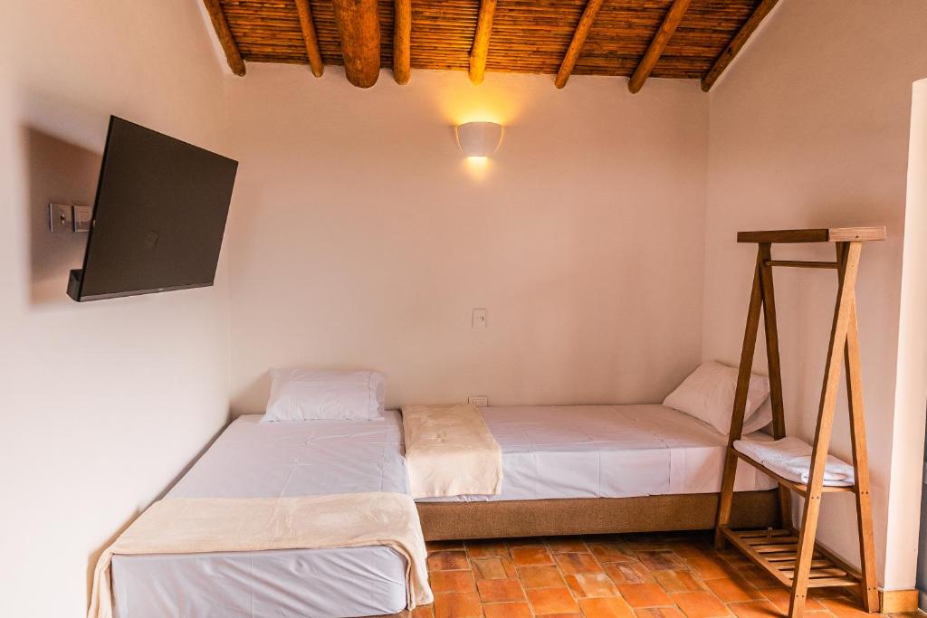 Voodi või voodid majutusasutuse Casa Guatí toas