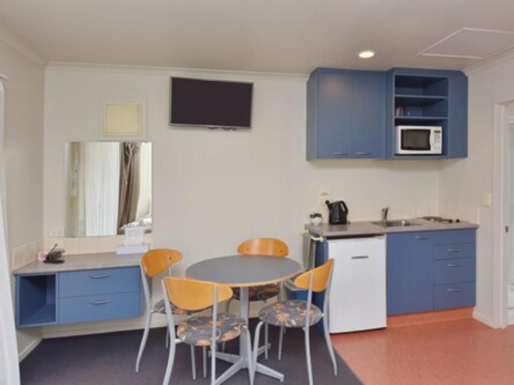 Kuchyň nebo kuchyňský kout v ubytování Northcote Motor Lodge