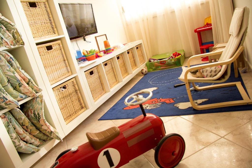 TV a/nebo společenská místnost v ubytování Casa Portofino Rooms&Breakfast