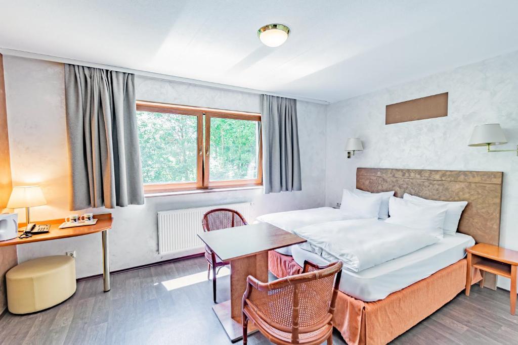 Postel nebo postele na pokoji v ubytování Aux Tanneries de Wiltz