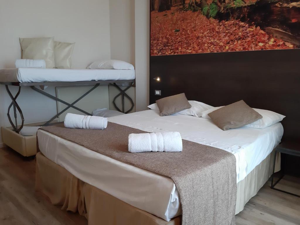 Postel nebo postele na pokoji v ubytování Hotel Life