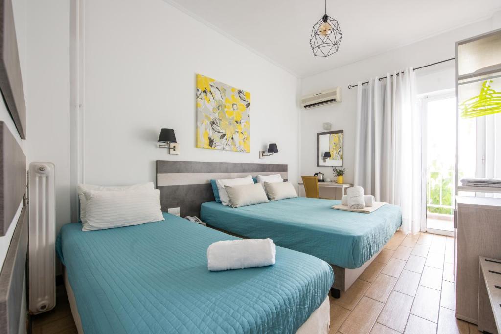 Postel nebo postele na pokoji v ubytování Myrto Hotel