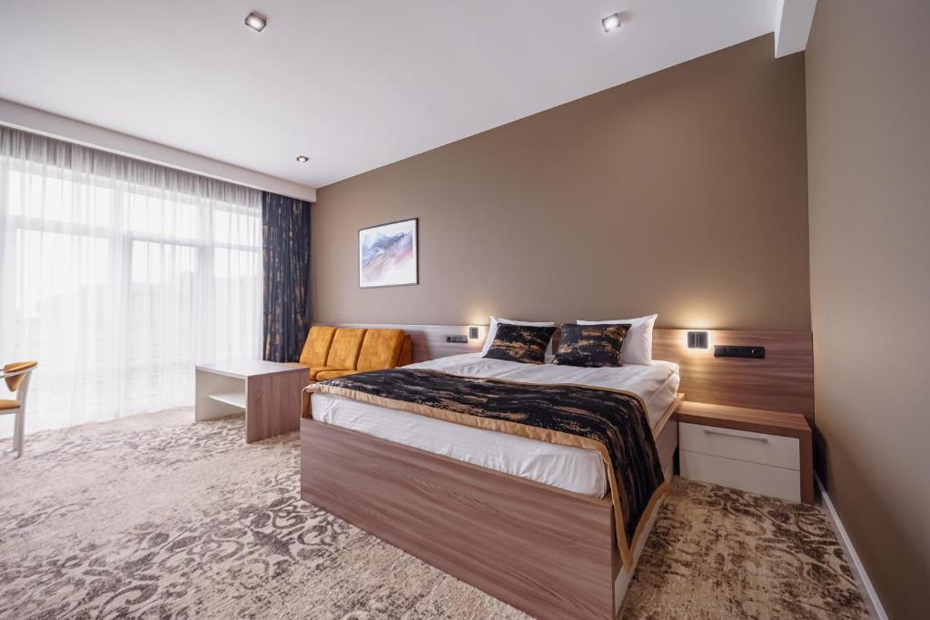 Postel nebo postele na pokoji v ubytování Rudison Hotel & Restaurant