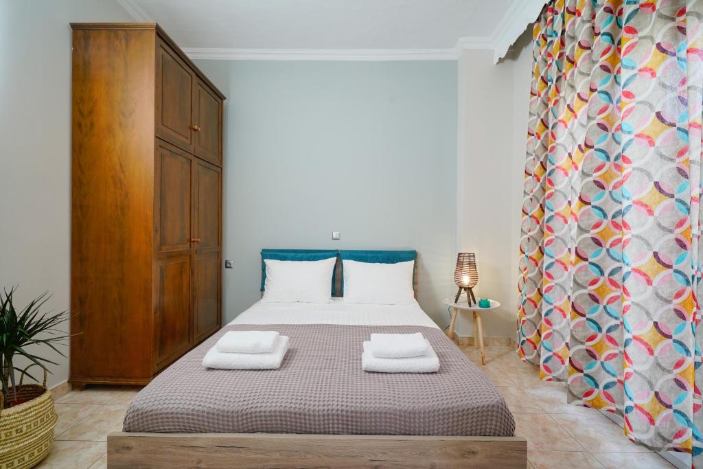 Postel nebo postele na pokoji v ubytování Notos House