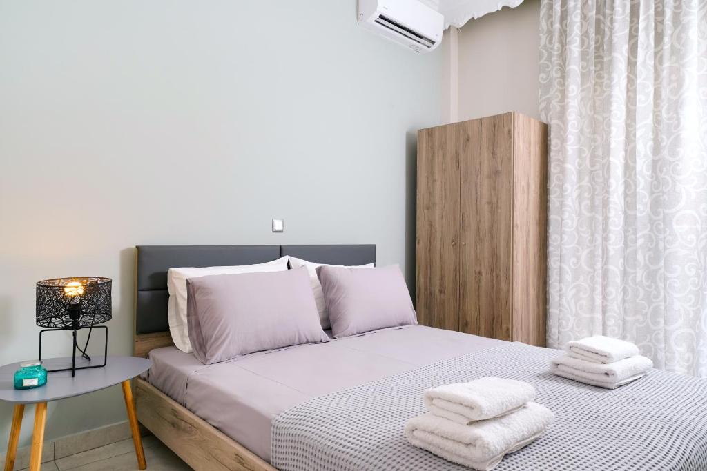Postel nebo postele na pokoji v ubytování Notos House