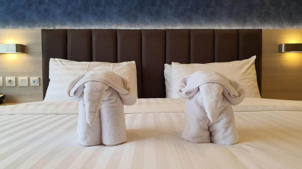 Postel nebo postele na pokoji v ubytování Classie Hotel