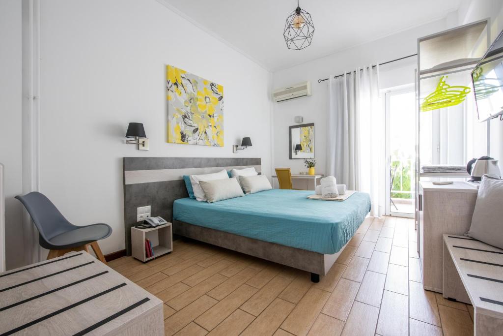 Postel nebo postele na pokoji v ubytování Myrto Hotel