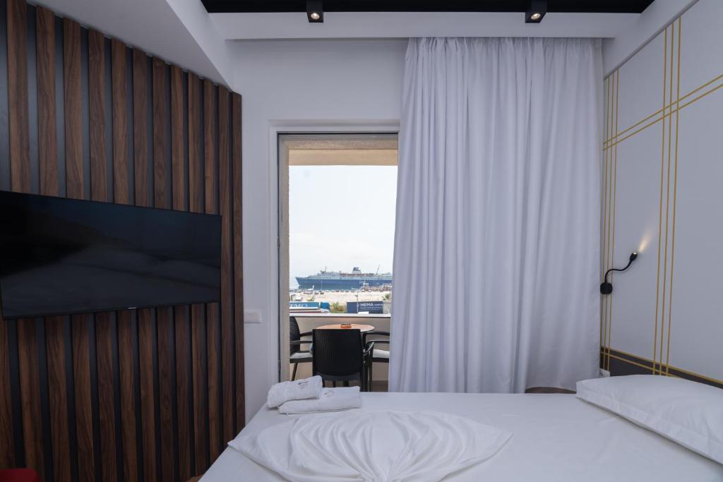 Postel nebo postele na pokoji v ubytování Hotel PortSide GF