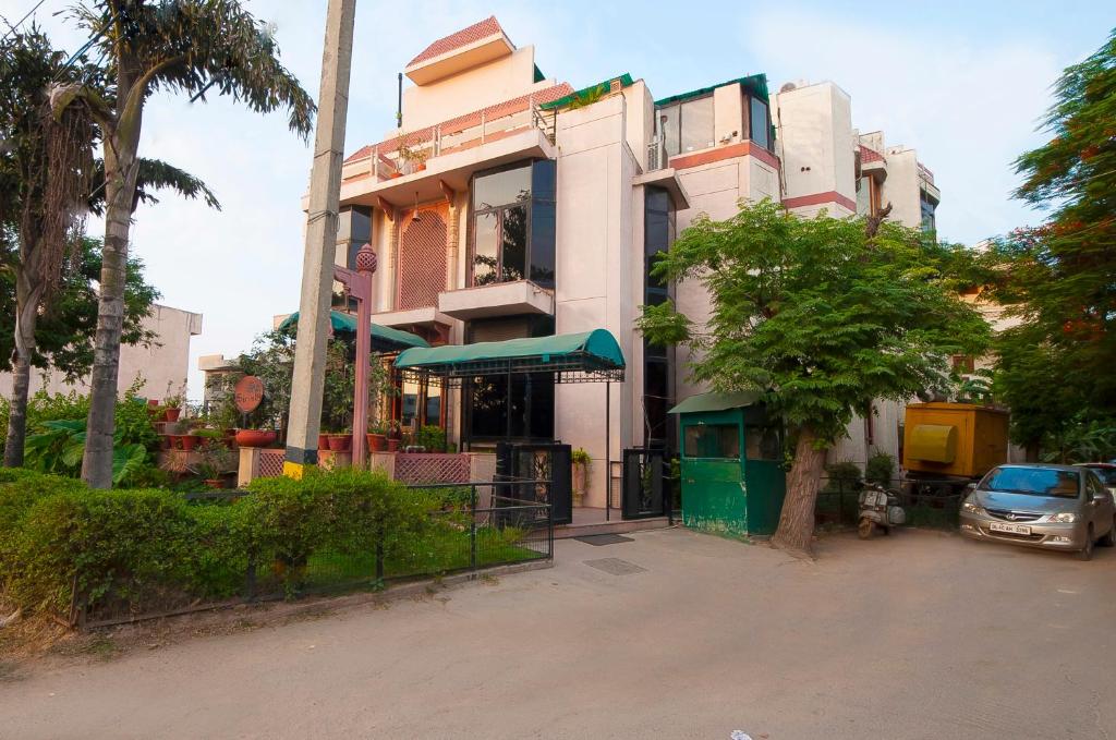 a building with a car parked in front of it at Siris 18 in Gurgaon