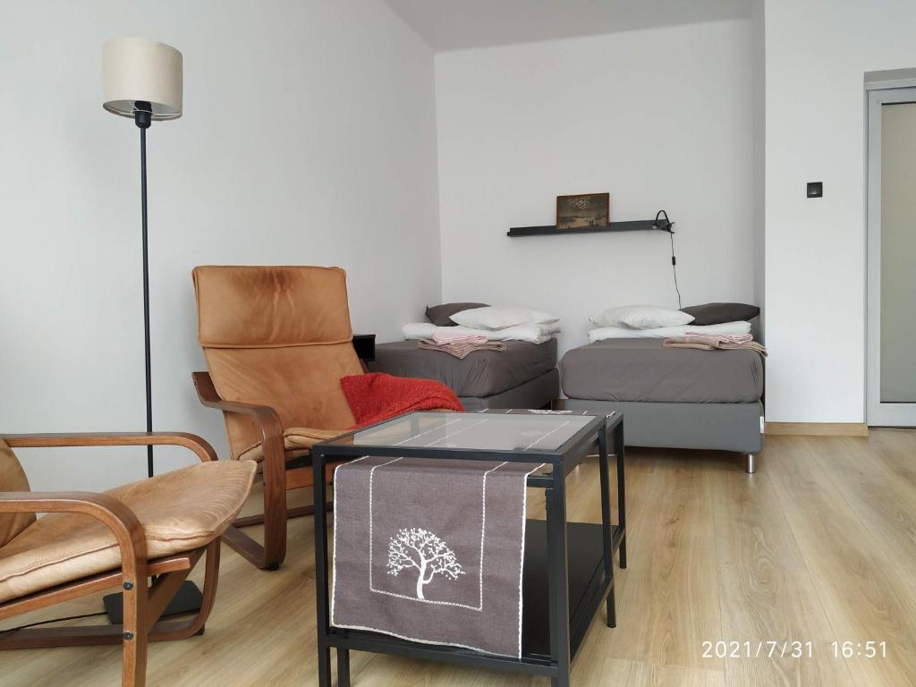 Posteľ alebo postele v izbe v ubytovaní APARTAMENT PRZY PARKU ŚRÓDMIEŚCIE