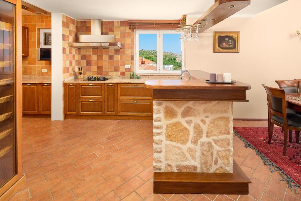 Kuchyň nebo kuchyňský kout v ubytování Hotel Villa Andrea