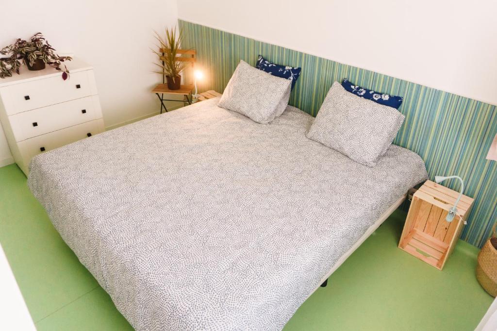 Llit o llits en una habitació de Hospedium Hostel República Surf House