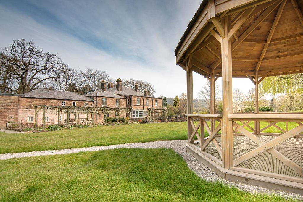 a gazebo in front of a mansion at Oakhill in Matlock