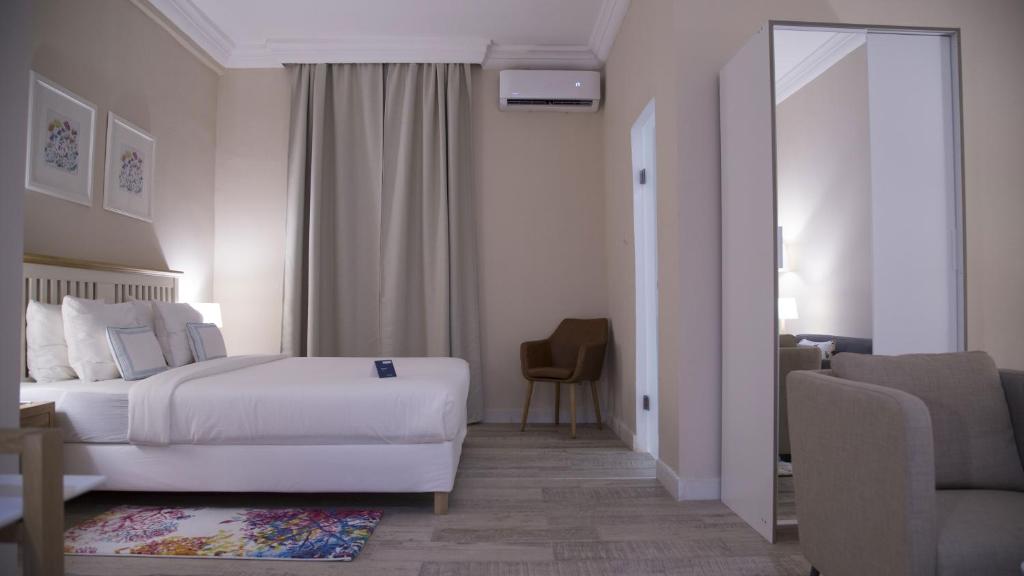 Postel nebo postele na pokoji v ubytování The Best Centric Hotel