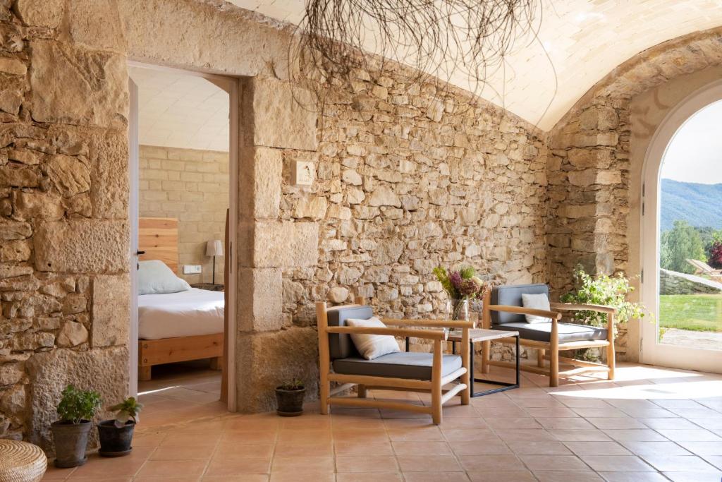 Postel nebo postele na pokoji v ubytování ECOTurisme Can Buch HOTEL