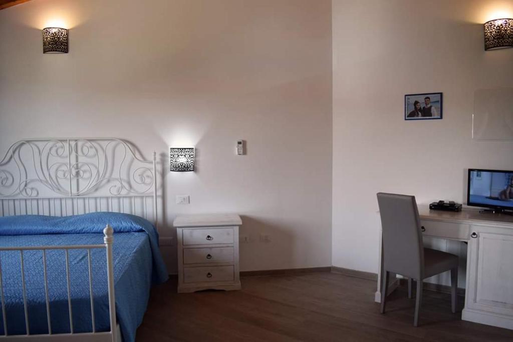 TV a/nebo společenská místnost v ubytování Corallo Rooms
