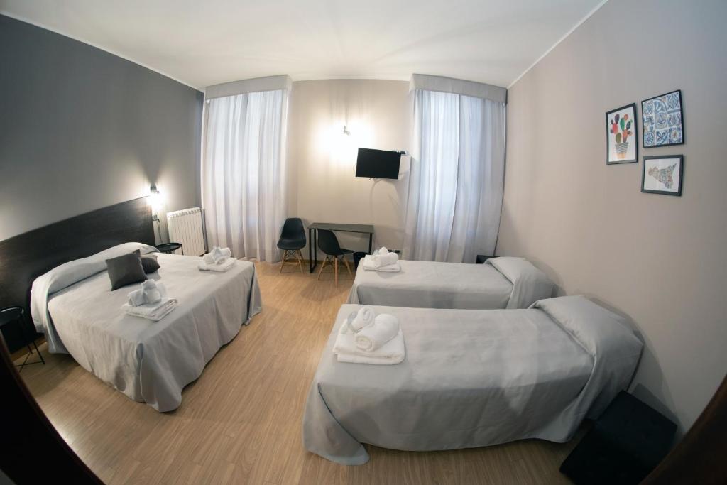 Posteľ alebo postele v izbe v ubytovaní Hotel Marconi