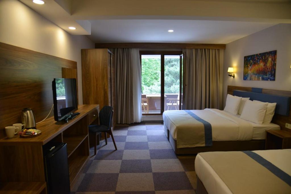 Postel nebo postele na pokoji v ubytování Feel & Live Hotel Villas Restaurant Sapanca