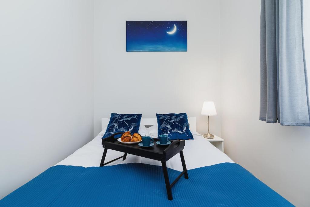 Posteľ alebo postele v izbe v ubytovaní Apartment Smoluchowskiego Cracow by Noclegi Renters
