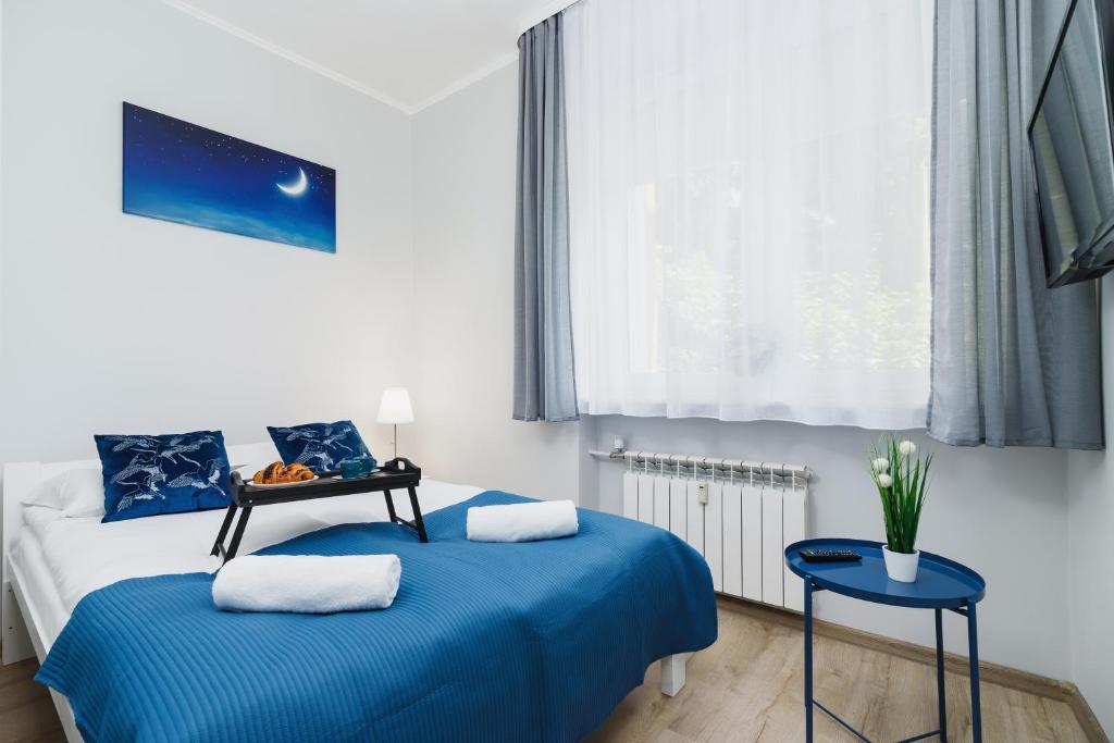 Posteľ alebo postele v izbe v ubytovaní Apartment Smoluchowskiego Cracow by Noclegi Renters