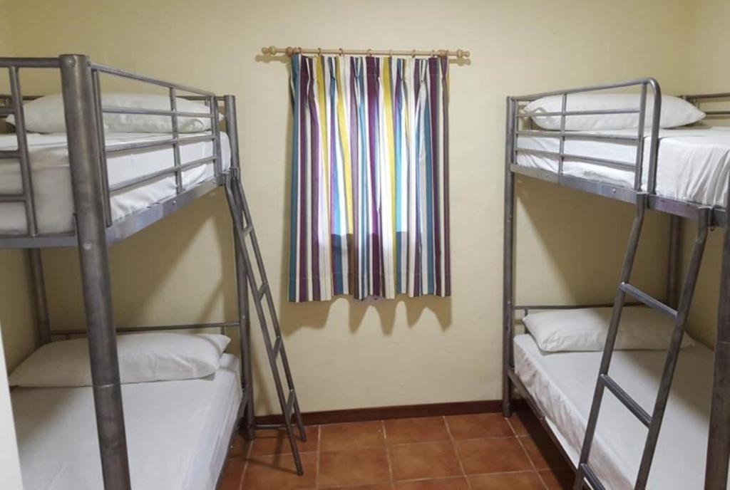Postel nebo postele na pokoji v ubytování Camping Santamarta