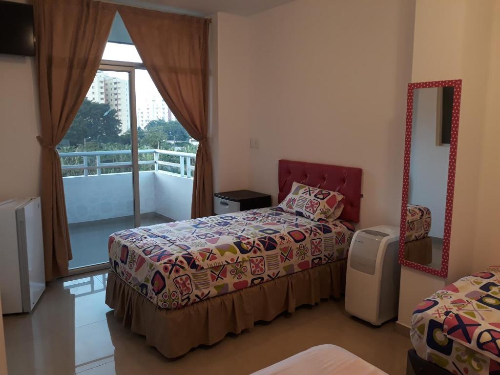 Postel nebo postele na pokoji v ubytování Hotel Almond Beach