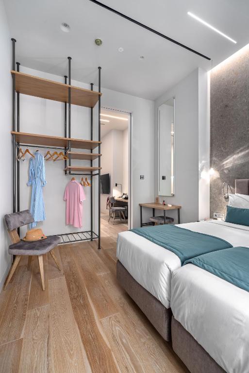 Postel nebo postele na pokoji v ubytování Hellenic Vibes Smart Hotel