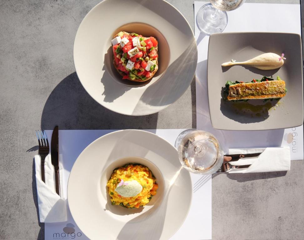a collage of pictures of plates of food and a bird at Margo Beach Hotel in Gythio
