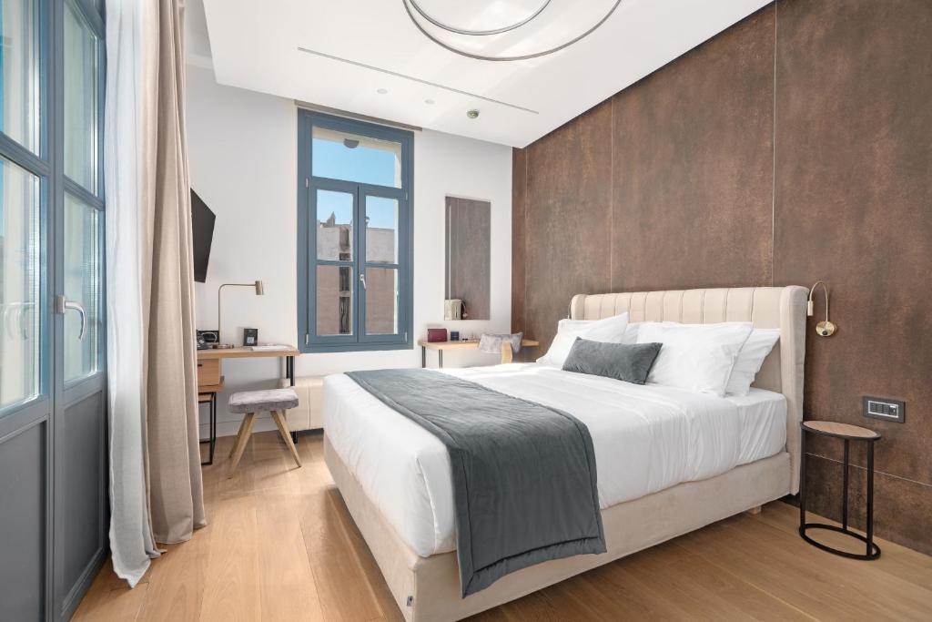 Postel nebo postele na pokoji v ubytování Hellenic Vibes Smart Hotel