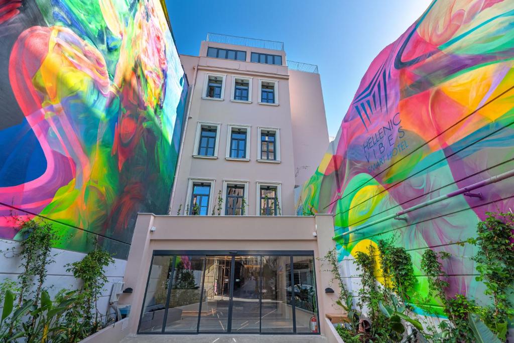 a building with a mural on the side of it at Hellenic Vibes Smart Hotel in Athens
