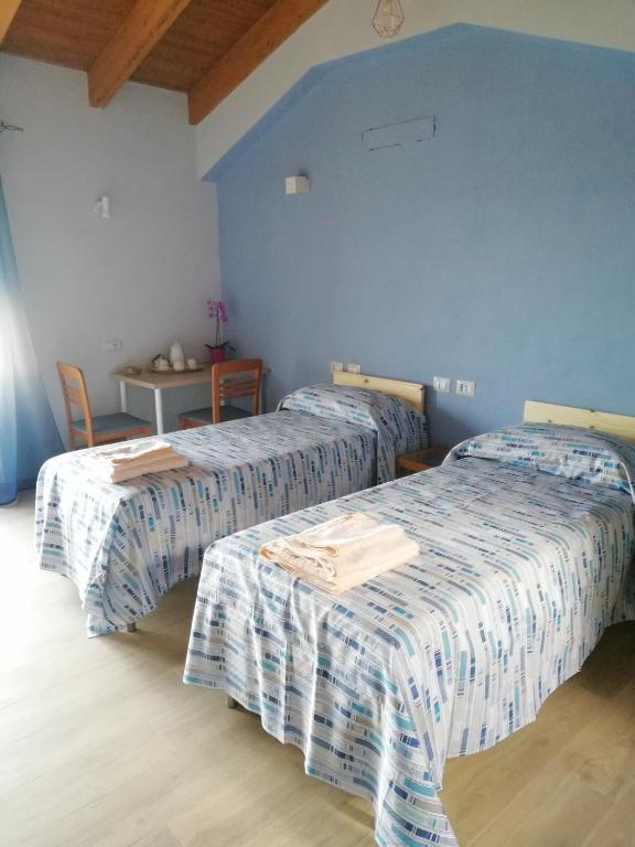 Postel nebo postele na pokoji v ubytování B&B La Plesna