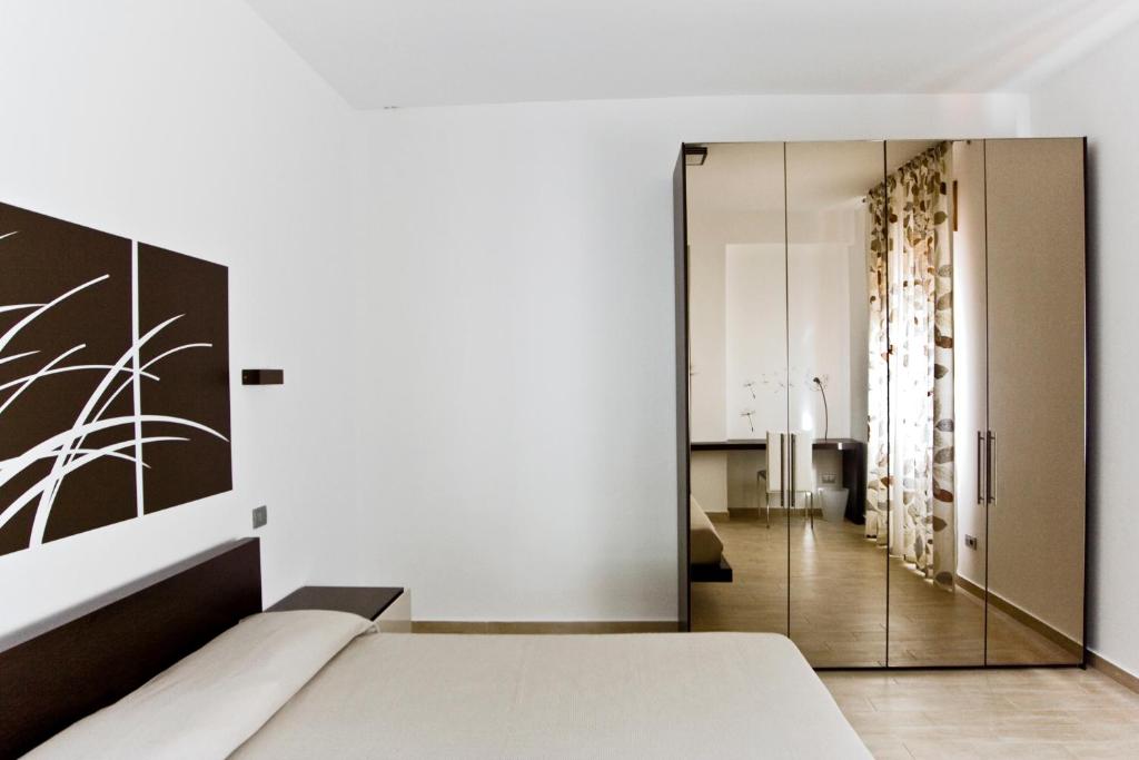 Postel nebo postele na pokoji v ubytování inStile aparthotel