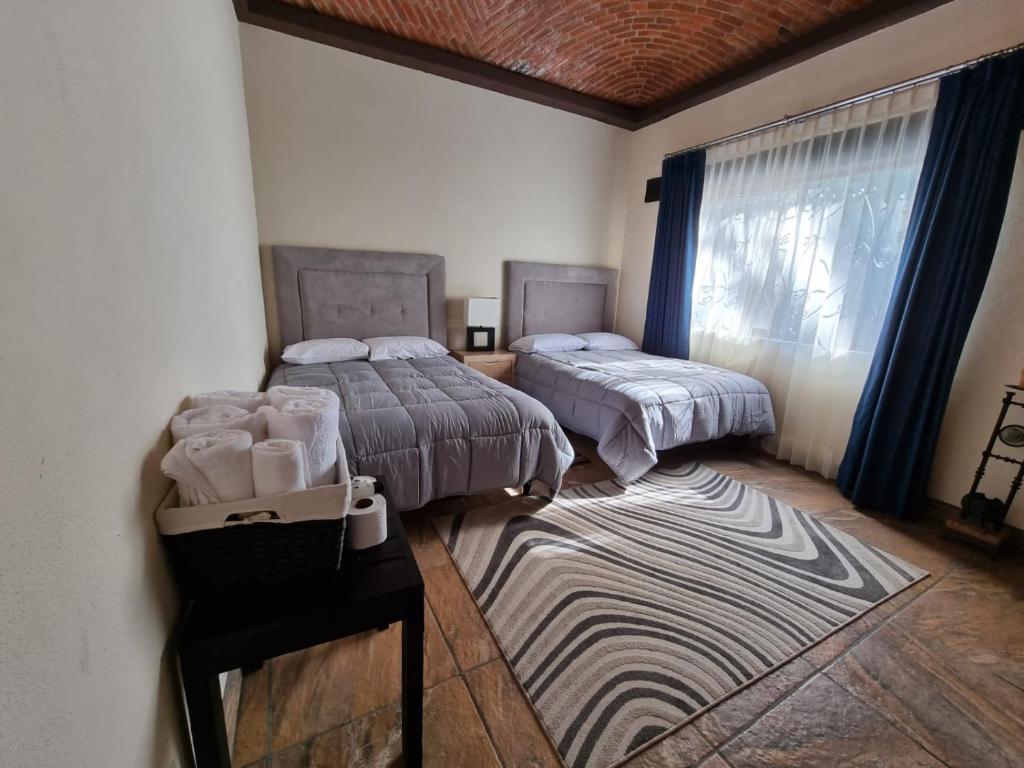 Postel nebo postele na pokoji v ubytování Real de Corralejo