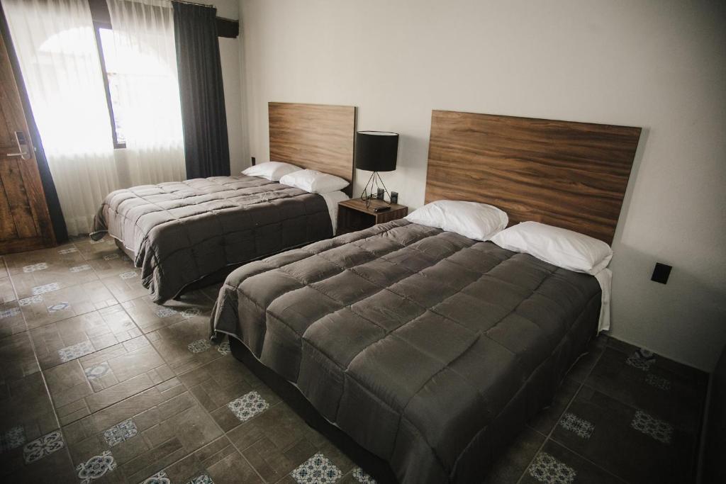 Postel nebo postele na pokoji v ubytování Real de Corralejo