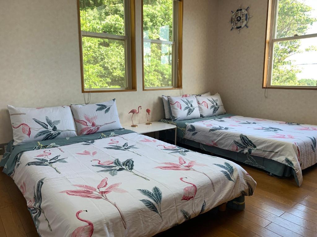 Postel nebo postele na pokoji v ubytování 半島の家