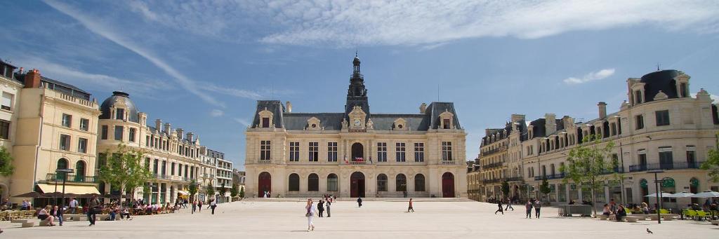 a large building with people walking in front of it at Studio à 8 min à pied du Futuroscope – 1&#47;4 pers in Chasseneuil-du-Poitou