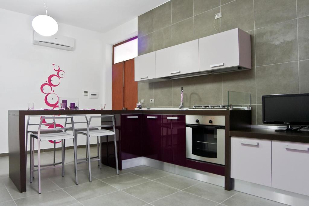 Kuchyň nebo kuchyňský kout v ubytování inStile aparthotel