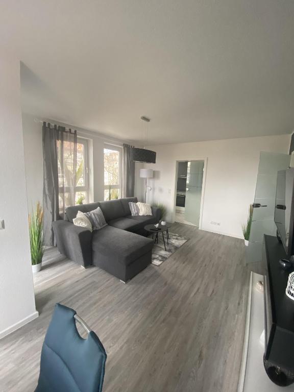 a living room with a couch and a table at Apartment Am Grünen Park in Erfurt