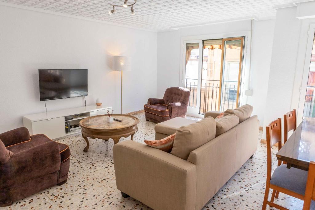 a living room with a couch and a table at Teniente Ruiz 27 in Elche
