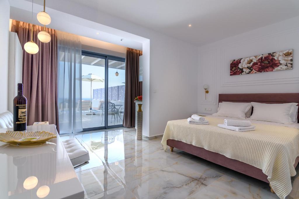 Postel nebo postele na pokoji v ubytování Dionisos Suites