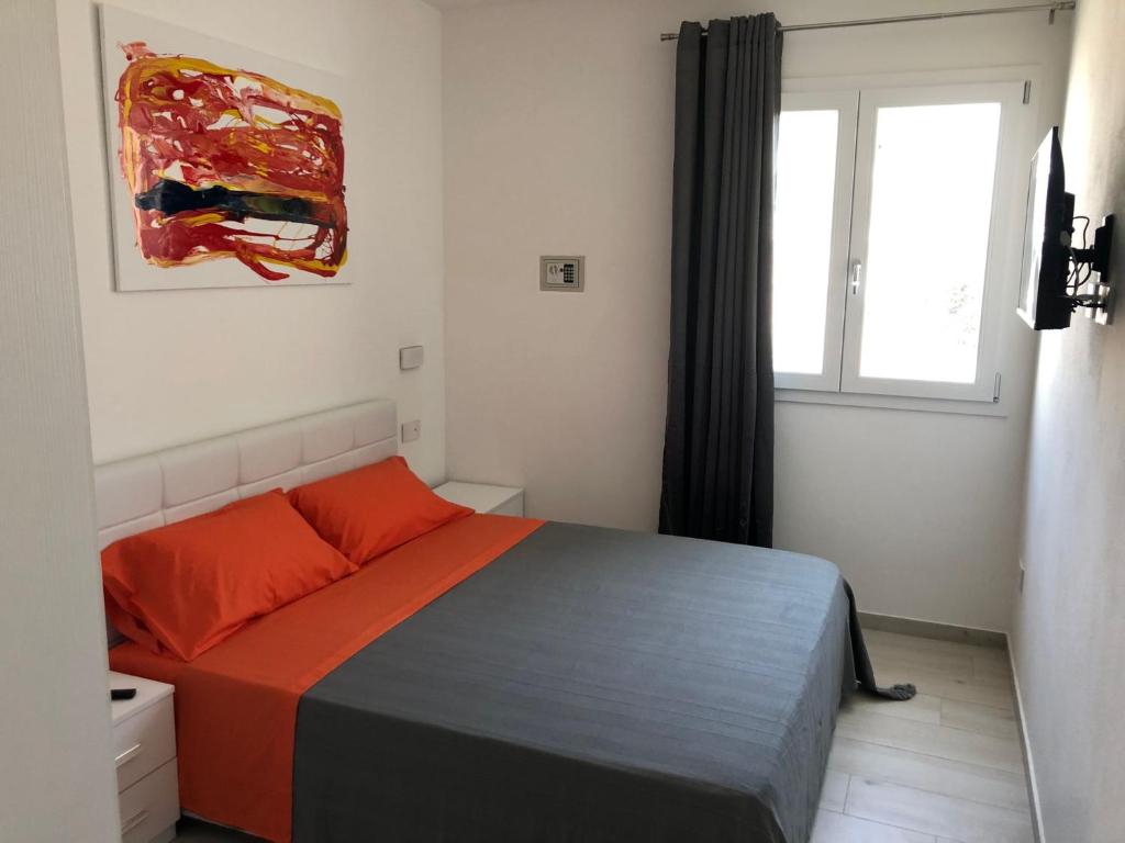 Postel nebo postele na pokoji v ubytování Skyandsand Alghero
