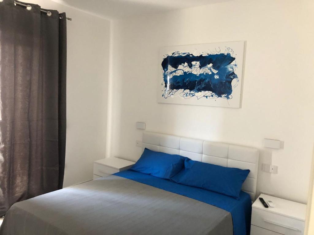 Postel nebo postele na pokoji v ubytování Skyandsand Alghero